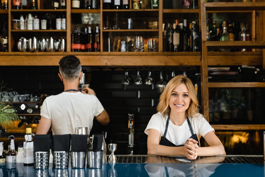 Barista waiters restaurant staff brewing coffee in coffee machine, making drinks cocktails orders
